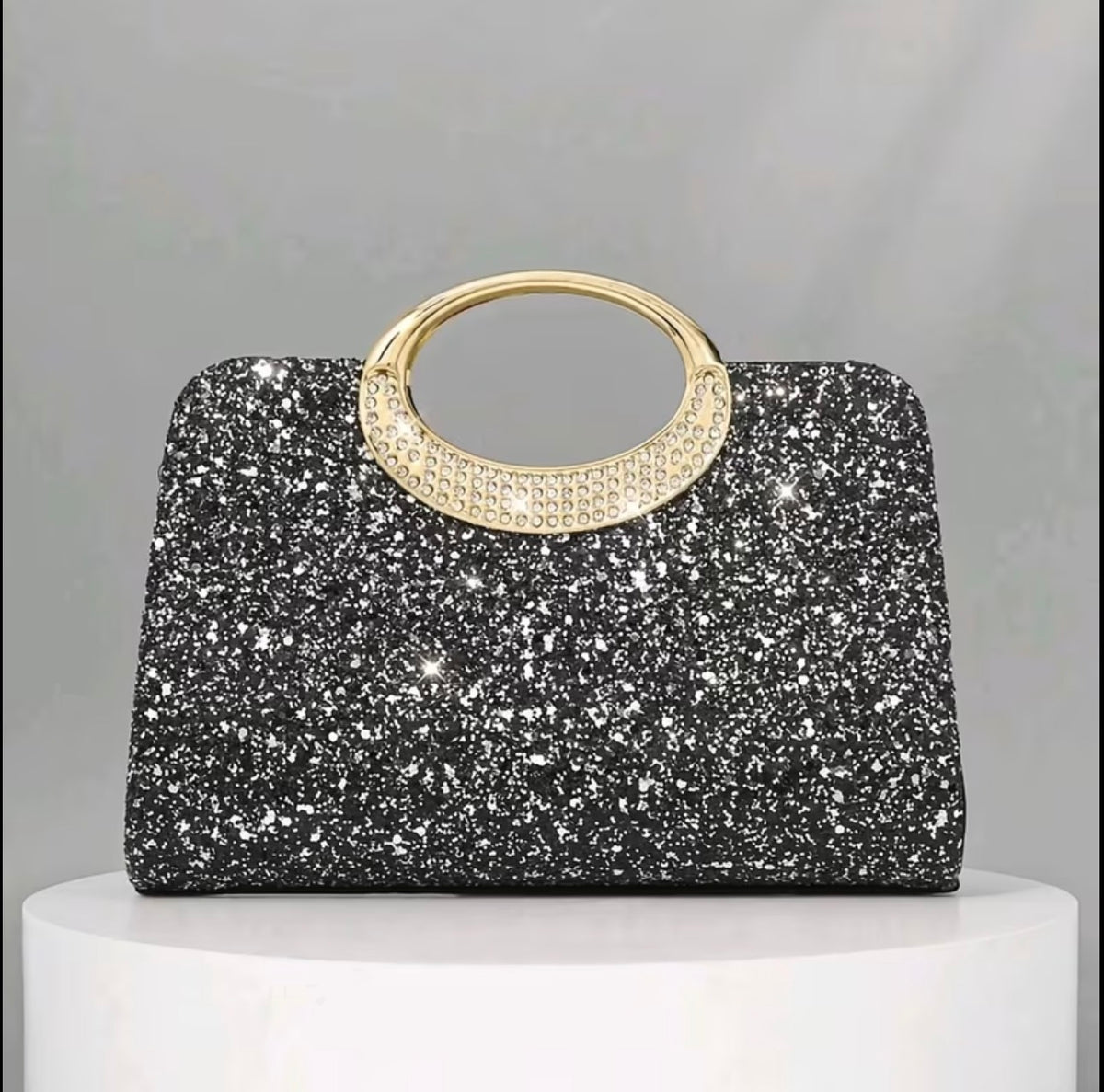 Black glitter evening bag with gold tone handles