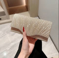 Gold glitter evening clutch bag