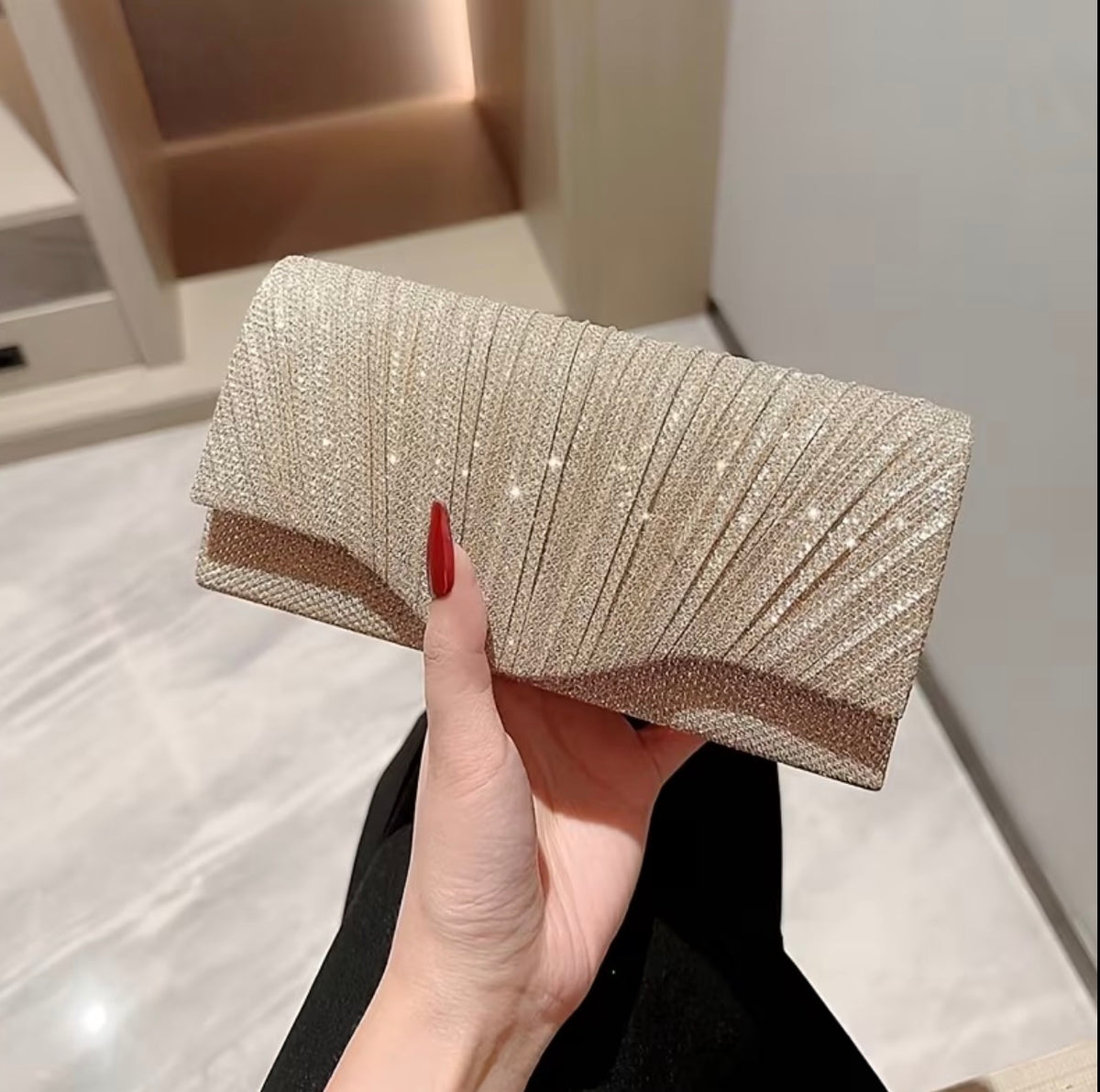 Gold glitter evening clutch bag