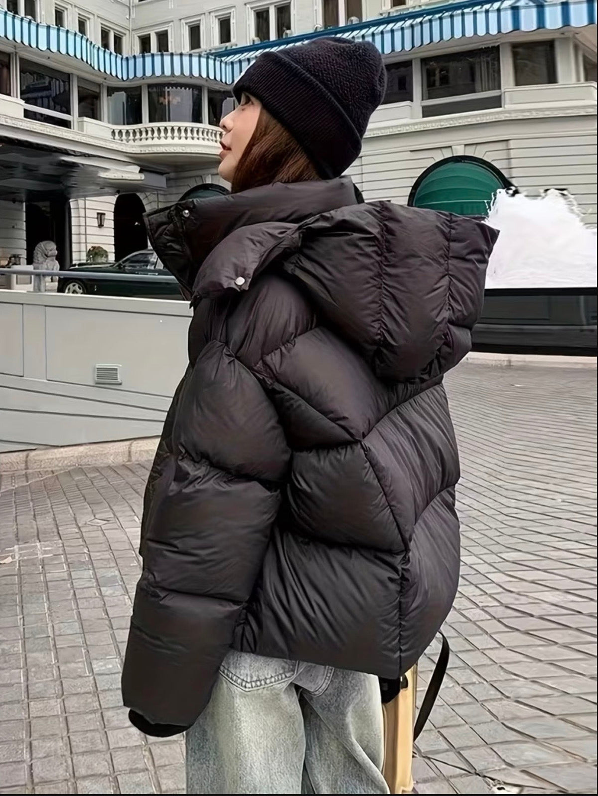 Black hooded puffer jacket side view