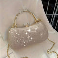 Champagne glitter clutch bag on a chair