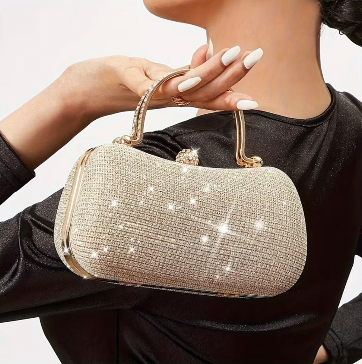 Champagne clutch bag carried with an outfit