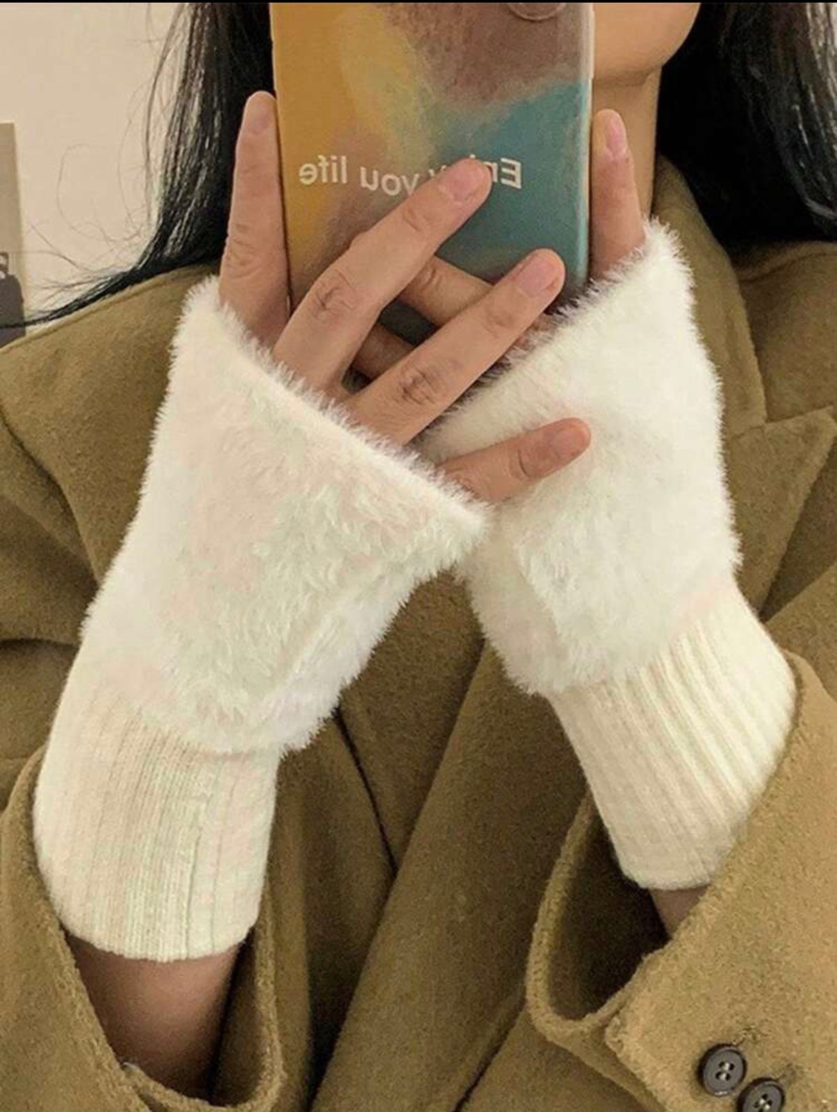 White faux fur fingerless gloves worn with coat